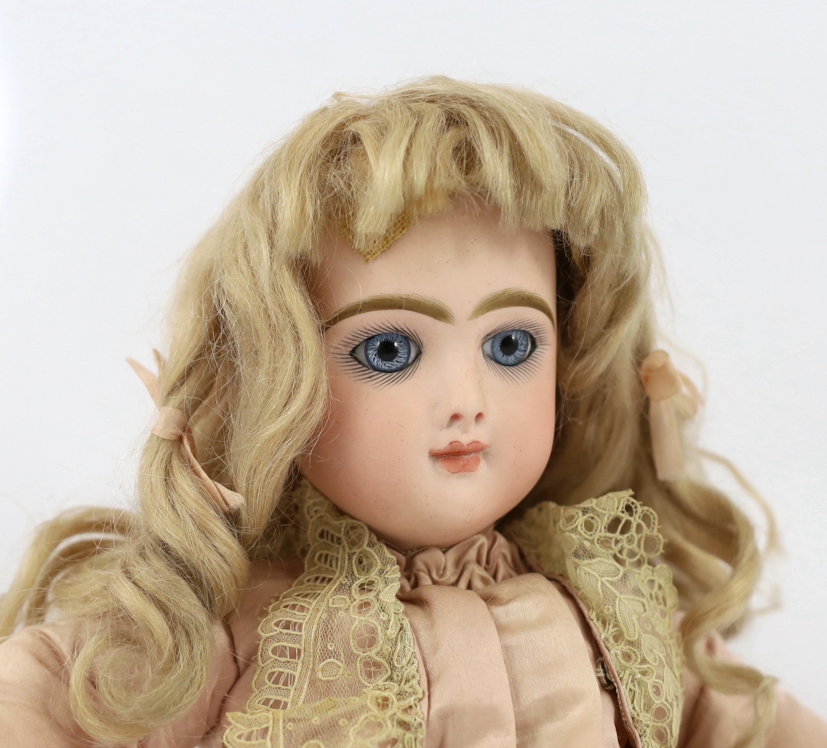 A Danel and Cie moulded bisque doll, French, 1891, 15.75in.